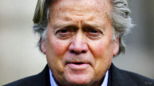 War Room TV show studio setup featuring Steve Bannon with multiple screens displaying news and political data